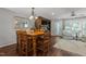 Dining room features a wooden table with seating for six, hardwood floors, and access to the living room at 1815 Crystal Downs Lane, Raleigh, NC 27604