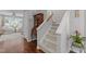 Welcoming entryway features hardwood floors, stairs, an antique cabinet, and a bright, airy living area at 1815 Crystal Downs Lane, Raleigh, NC 27604