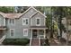 Charming two-story home featuring a covered front porch and tidy landscaping at 1815 Crystal Downs Lane, Raleigh, NC 27604