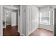Spacious hallway with wood floors, a large closet, and a glimpse into the bathroom at 1815 Crystal Downs Lane, Raleigh, NC 27604