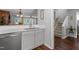 Open kitchen with stainless steel dishwasher and a view of dining and living areas at 1815 Crystal Downs Lane, Raleigh, NC 27604