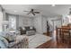 Inviting living room featuring a plush sofa, floral armchairs, and natural light at 1815 Crystal Downs Lane, Raleigh, NC 27604