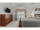 Main bedroom with vaulted ceiling, TV and window at 1815 Crystal Downs Lane, Raleigh, NC 27604