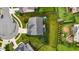 Aerial view showcasing the house, backyard, and landscaping from above at 184 Elgin Ct, Burlington, NC 27215