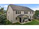 Back exterior view of home with covered patio, fenced yard, and outdoor seating at 184 Elgin Ct, Burlington, NC 27215