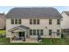 Back exterior featuring a covered patio, outdoor seating, and a well-maintained backyard at 184 Elgin Ct, Burlington, NC 27215