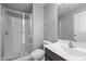 Bright bathroom featuring a glass-enclosed shower, modern vanity, and neutral color palette at 184 Elgin Ct, Burlington, NC 27215