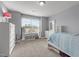 Bright bedroom with neutral walls and carpet, plus large windows for natural light at 184 Elgin Ct, Burlington, NC 27215
