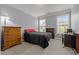 Cozy bedroom with two windows and simple furnishings at 184 Elgin Ct, Burlington, NC 27215