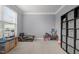 Neutral bedroom with a play kitchen, play bench, and storage at 184 Elgin Ct, Burlington, NC 27215