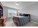 Bedroom features a bed, wooden dresser, and a large window with natural light at 184 Elgin Ct, Burlington, NC 27215