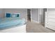 Bedroom featuring light gray walls, plush carpeting, and a comfortable bed at 184 Elgin Ct, Burlington, NC 27215