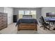 Bedroom featuring wood furniture, gray walls, carpet and a large bright window at 184 Elgin Ct, Burlington, NC 27215
