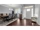 Formal dining area with hardwood flooring, crown molding, and a window letting in natural light at 184 Elgin Ct, Burlington, NC 27215