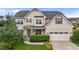 Traditional two-story home with neutral siding, gray shutters, and an attached two-car garage at 184 Elgin Ct, Burlington, NC 27215