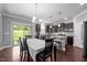 An open-concept eat-in kitchen featuring stainless steel appliances, a breakfast bar and plenty of cabinet space at 184 Elgin Ct, Burlington, NC 27215