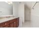 This bathroom includes a granite countertop, cherry wood vanity, and tiled shower at 20002 Fountain, Chapel Hill, NC 27517