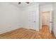 Bright bedroom featuring hardwood floors, white trim and a ceiling fan at 20002 Fountain, Chapel Hill, NC 27517