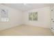 Bedroom with neutral carpet, ceiling fan, and natural light from the windows at 20002 Fountain, Chapel Hill, NC 27517