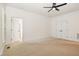 Bedroom featuring carpet, ceiling fan, and an ensuite bathroom at 20002 Fountain, Chapel Hill, NC 27517