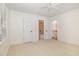 Bedroom features a ceiling fan and access to the bathroom and hallway at 20002 Fountain, Chapel Hill, NC 27517