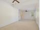 Bright bonus room with carpet, neutral walls, white trim, and ceiling fan at 20002 Fountain, Chapel Hill, NC 27517