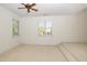 Large bonus room with a ceiling fan and tiered flooring at 20002 Fountain, Chapel Hill, NC 27517