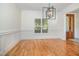 Elegant dining room with hardwood floors and a modern chandelier at 20002 Fountain, Chapel Hill, NC 27517
