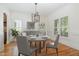Elegant dining room with hardwood floors, modern chandelier, and stylish decor for a sophisticated ambiance at 20002 Fountain, Chapel Hill, NC 27517