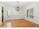 Bright dining room featuring hardwood floors and decorative molding at 20002 Fountain, Chapel Hill, NC 27517