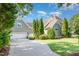 Charming two-story home with lush landscaping, attached garage, and inviting curb appeal at 20002 Fountain, Chapel Hill, NC 27517