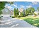 Charming two-story home with lush landscaping, attached garage, and inviting curb appeal at 20002 Fountain, Chapel Hill, NC 27517