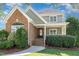 Charming home with brick and siding, front yard landscaping, and a welcoming entrance at 20002 Fountain, Chapel Hill, NC 27517