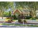 Charming two-story home with a brick accent, mature trees, and a well-manicured lawn at 20002 Fountain, Chapel Hill, NC 27517