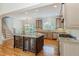 Spacious kitchen with large island, stainless steel appliances, and custom cabinets offering ample counter space at 20002 Fountain, Chapel Hill, NC 27517