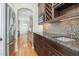 Gourmet kitchen featuring custom cabinets, granite countertops and a stainless steel refrigerator at 20002 Fountain, Chapel Hill, NC 27517