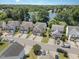Beautiful aerial view of homes near a lake with mature trees and well maintained lawns at 2053 Thornblade Dr, Raleigh, NC 27604