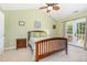 Serene bedroom with french doors leading to a private balcony for a relaxing retreat at 2053 Thornblade Dr, Raleigh, NC 27604