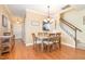 Inviting dining area with a view of the staircase, perfect for Gathering meals and gatherings at 2053 Thornblade Dr, Raleigh, NC 27604