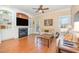 Cozy living room featuring a fireplace, built-in shelves, and hardwood floors for comfortable living at 2053 Thornblade Dr, Raleigh, NC 27604