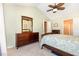 Bright main bedroom features a ceiling fan and neutral carpet at 2053 Thornblade Dr, Raleigh, NC 27604