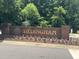 Community entrance sign in brick with flowerbed at 2053 Thornblade Dr, Raleigh, NC 27604