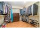 Spacious walk-in closet with shelving, hanging racks, and hardwood floors at 2053 Thornblade Dr, Raleigh, NC 27604