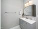 Bright bathroom with gray vanity, white countertop, and modern mirror at 2112 Dunn Rd, Raleigh, NC 27614