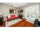 Bright dining room featuring a chandelier and access to the outdoors at 2112 Dunn Rd, Raleigh, NC 27614