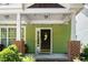 Inviting front porch with stylish accents and ample space for seating at 2112 Dunn Rd, Raleigh, NC 27614