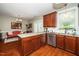 Open kitchen with granite countertops, stainless steel appliances, and hardwood floors at 2112 Dunn Rd, Raleigh, NC 27614