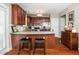 Kitchen features granite countertops, wood cabinets, and stainless steel appliances at 2112 Dunn Rd, Raleigh, NC 27614