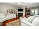 Cozy living room with a fireplace and lots of natural light at 2112 Dunn Rd, Raleigh, NC 27614