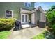 Outdoor patio space with concrete pavers, a grill, and access to the home's back entrance at 2112 Dunn Rd, Raleigh, NC 27614